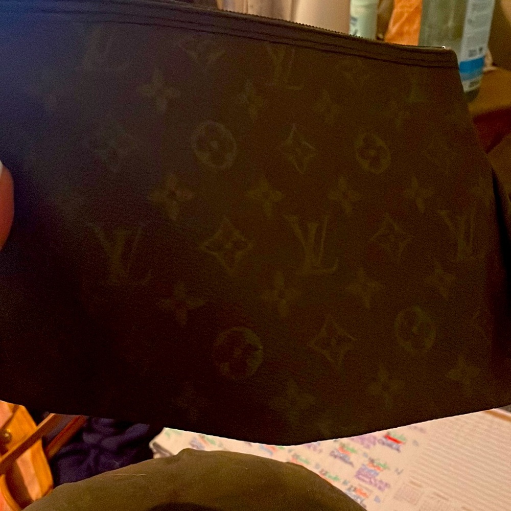 Perfect for a make up bag, definitely real! In great condition!